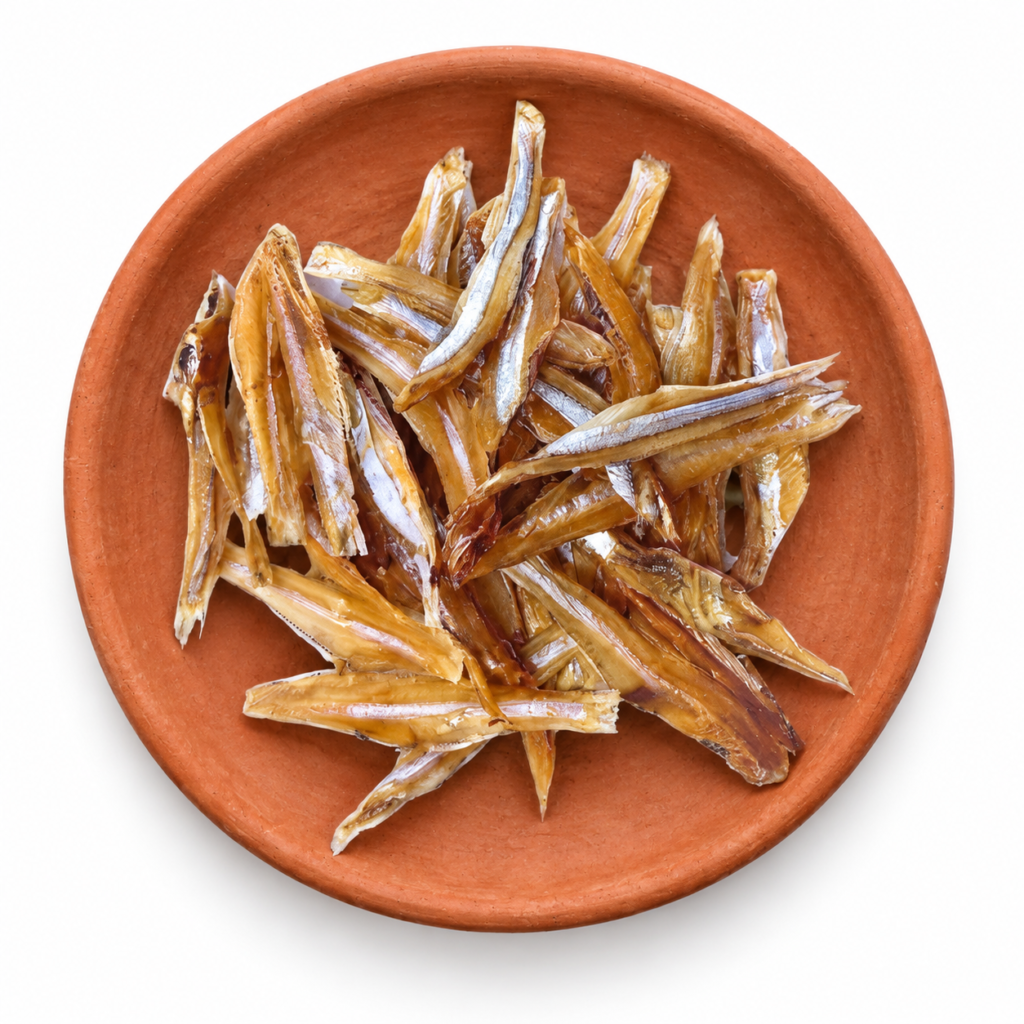 Dried Anchovy (Headless) on a Kerala clay plate against white