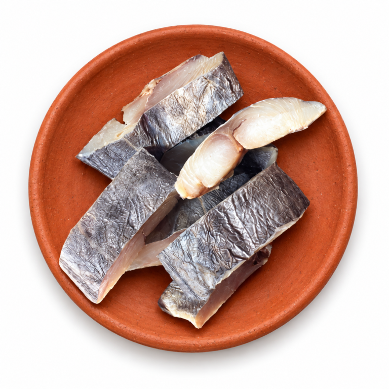 Dried King Fish on a Kerala clay plate against white