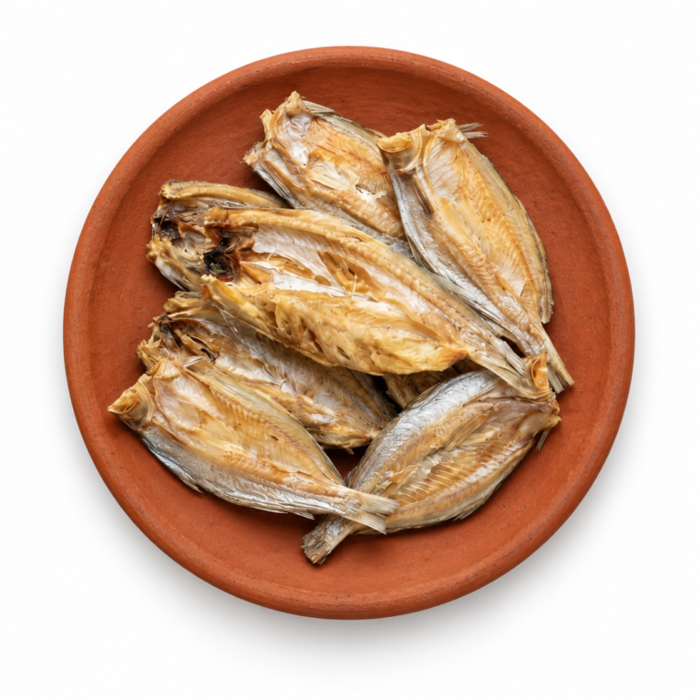 Dried Snakehead on a Kerala clay plate against white